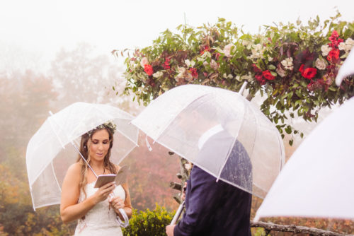 Bride reads vows at rainy elopement 