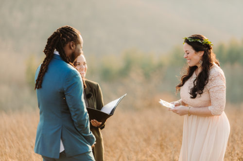 Bride laughs with Groom during elopement ceremony