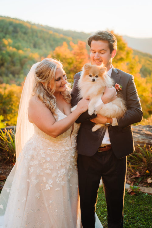 Bride and Groom pose with dog 