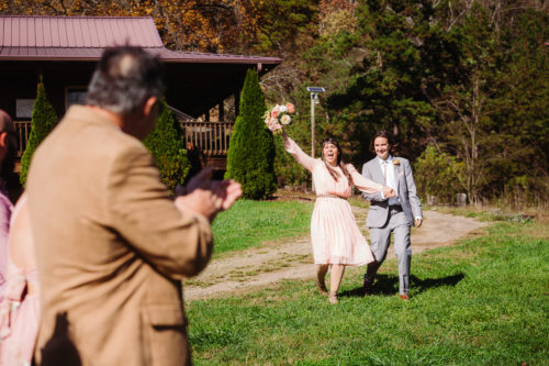 Bride throws up bouquet to celebrate walking alongside groom 