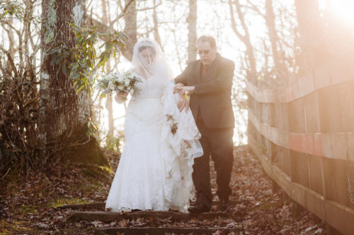 Bride goes down steps with help from Father on elopement