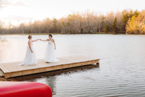 Ladies dance on dock lLGBT Wedding elopement 