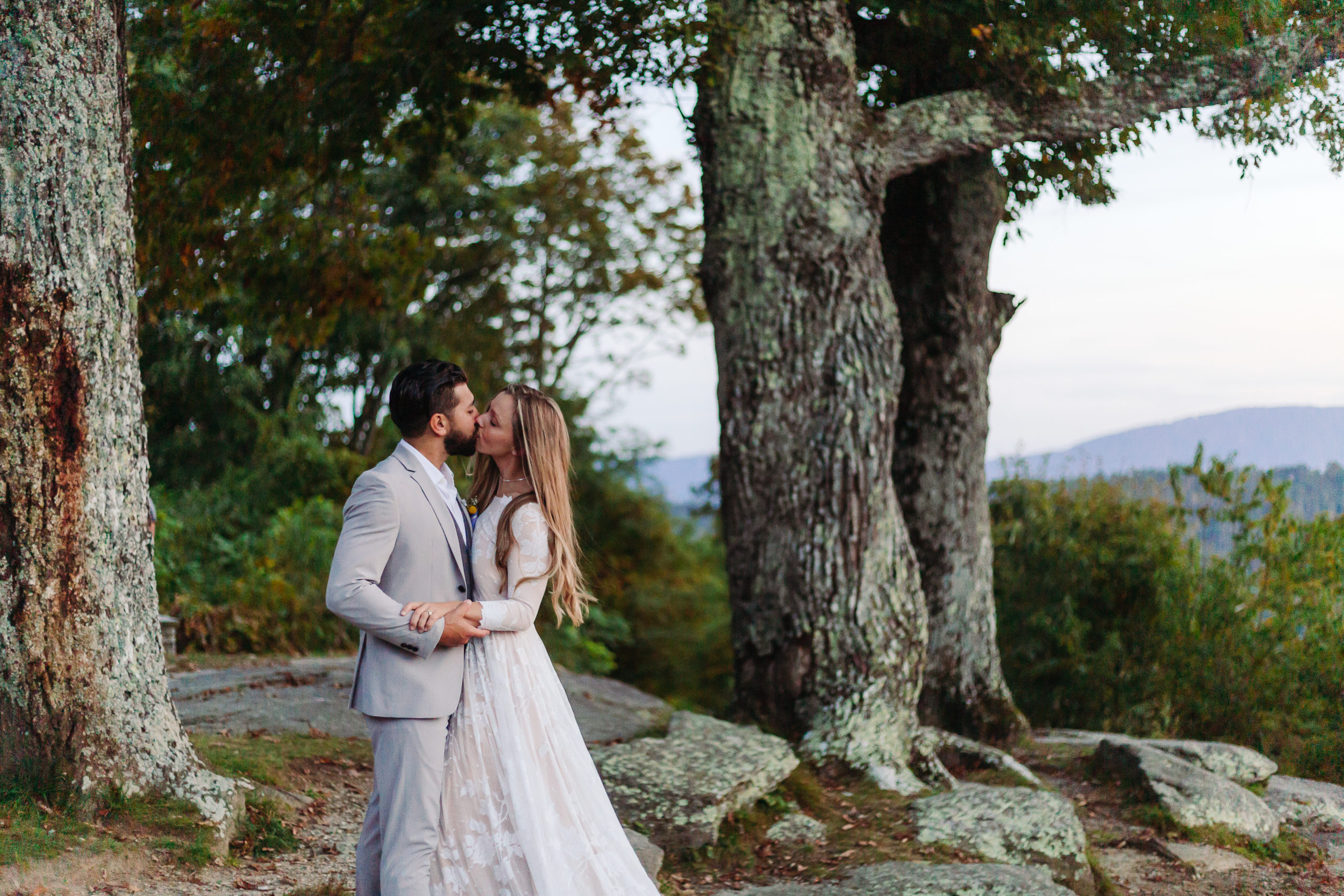 Couple kisses Jump off rock elopement Elope Outdoors