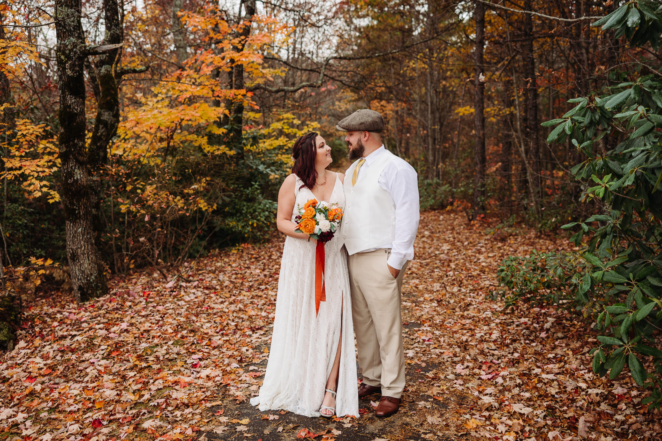 Couple Poses Amoung Leaves Fall Asheville Elopement Elope Outdoors All Inclusive Package ~ Elope 7951