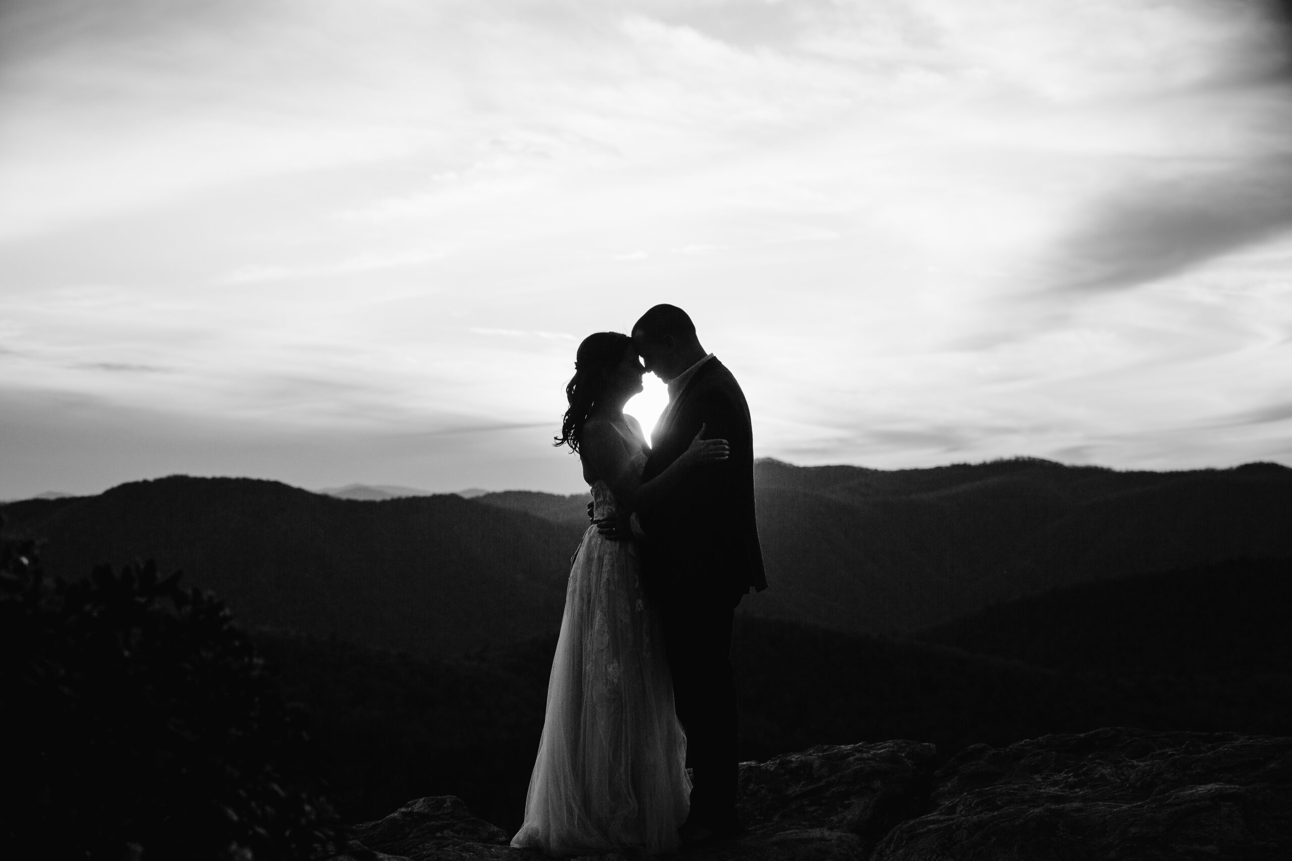 COUPLE EMBRACES SUNSET Linville Gorge elopemen ~ Elope Outdoors