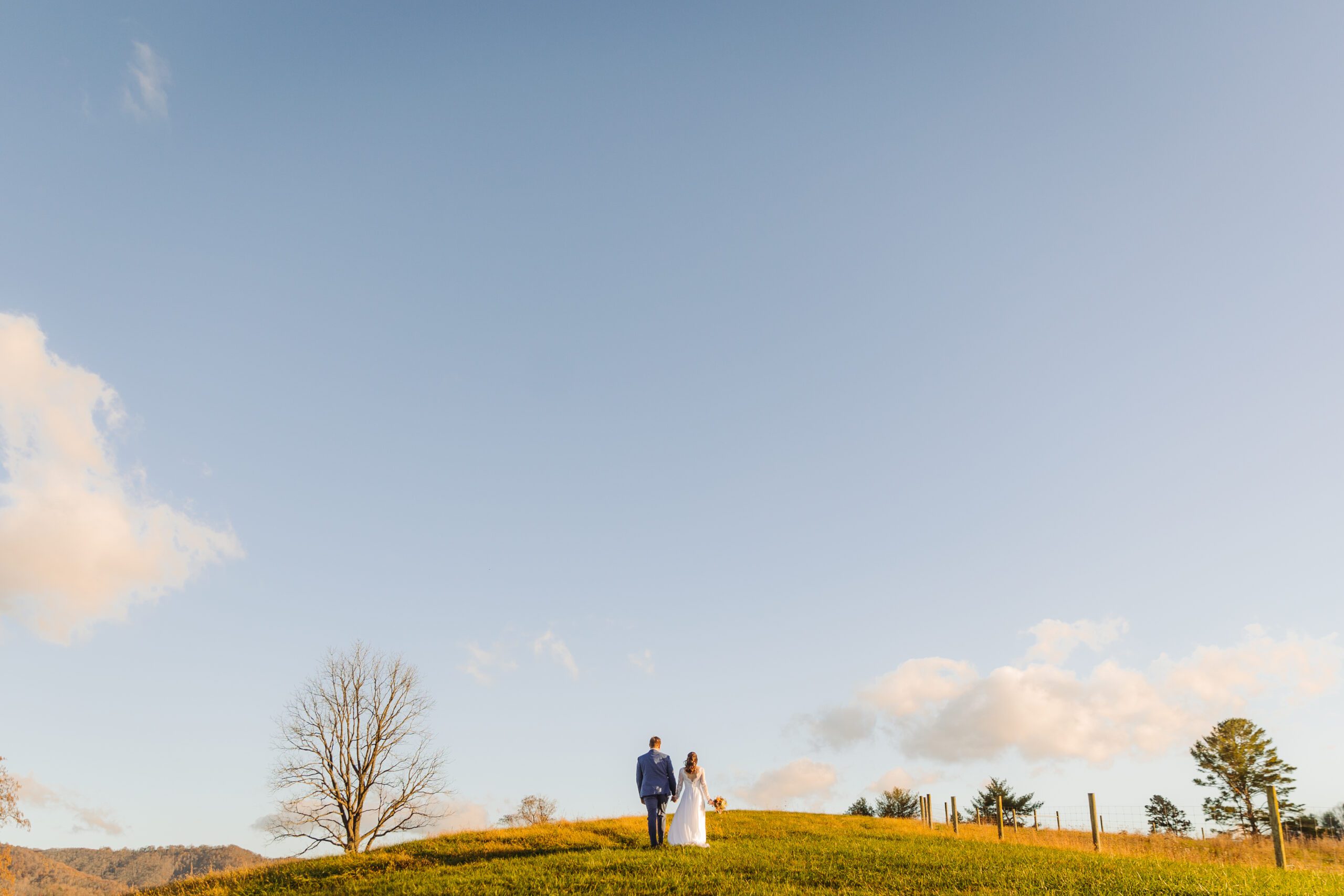 husband and wife walking to their ceremony site