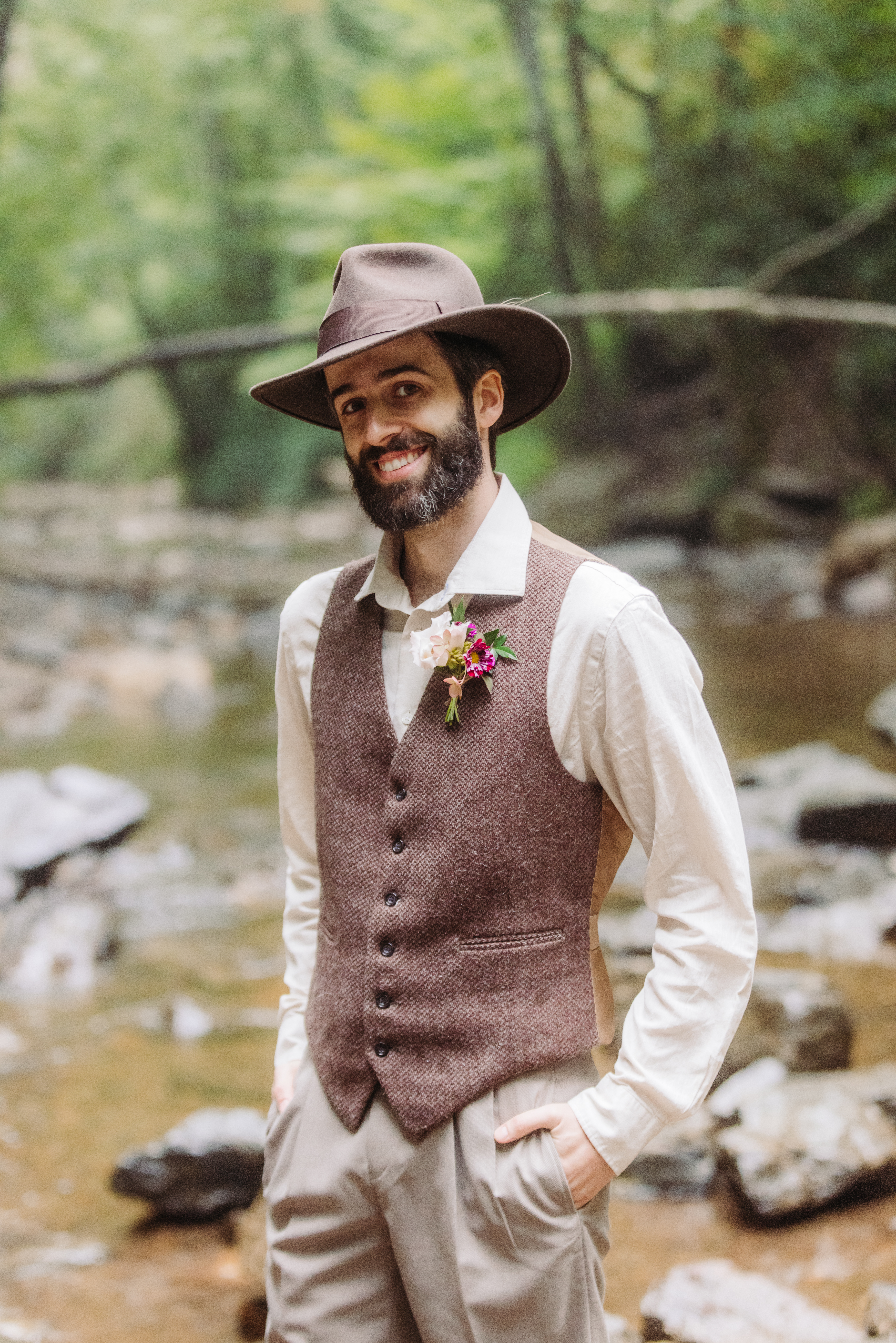 A collection of images showcasing the highlights of a couple’s waterfall elopement day—an intimate ceremony, the bride’s bouquet, the groom’s boutonniere, and other special moments, all set against the backdrop of lush greenery and the stunning waterfall.
