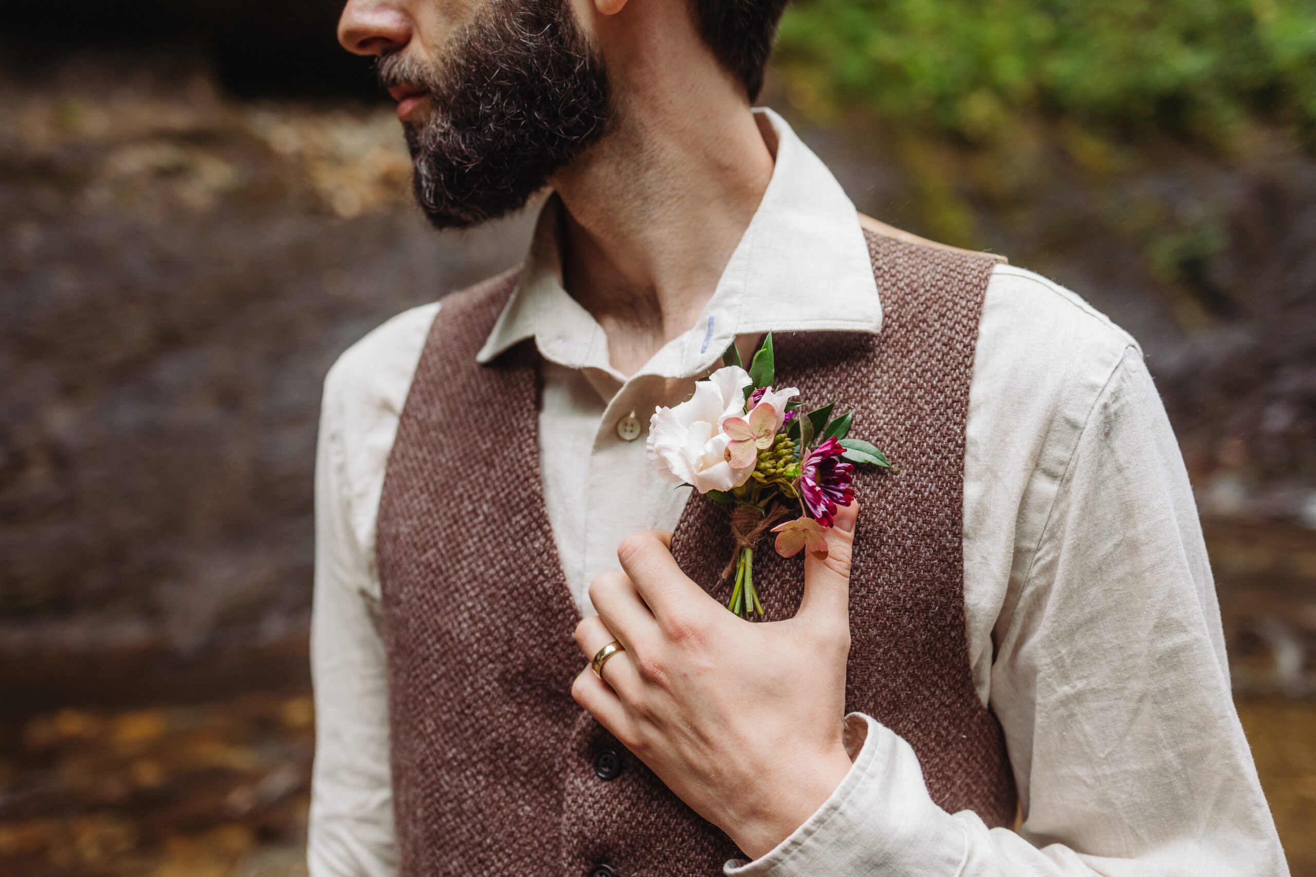 A collection of images showcasing the highlights of a couple’s waterfall elopement day—an intimate ceremony, the bride’s bouquet, the groom’s boutonniere, and other special moments, all set against the backdrop of lush greenery and the stunning waterfall.