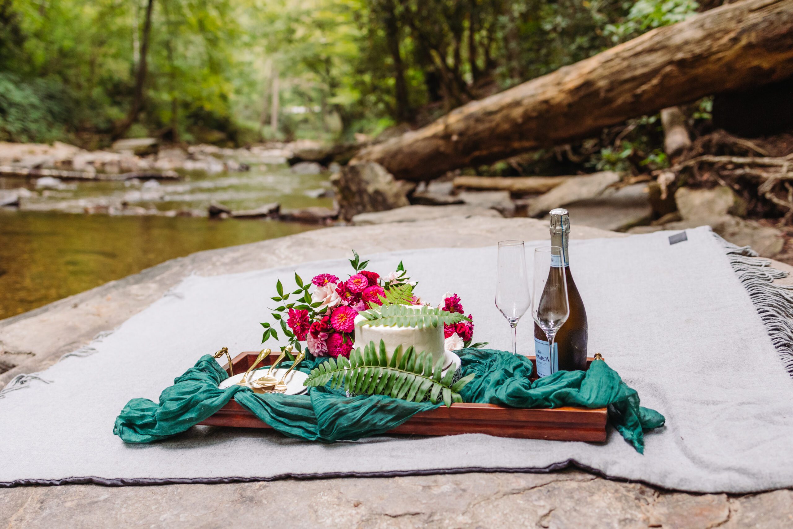 A collection of images showcasing the highlights of a couple’s waterfall elopement day—an intimate ceremony, the bride’s bouquet, the groom’s boutonniere, and other special moments, all set against the backdrop of lush greenery and the stunning waterfall.