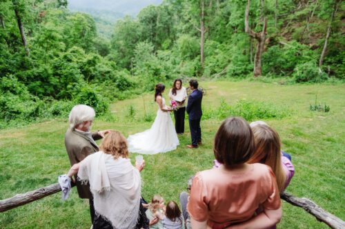 Bride and groom exchanging vows on a private mountaintop elopement near Asheville