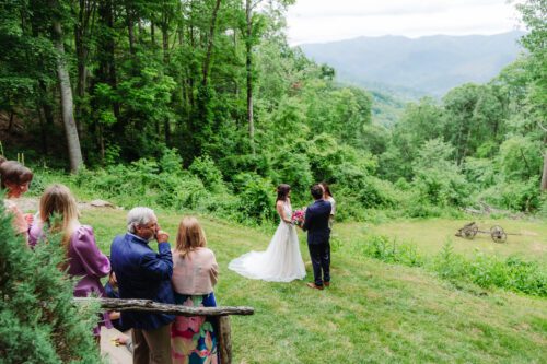 Bride and groom exchanging vows on a private mountaintop elopement near Asheville
