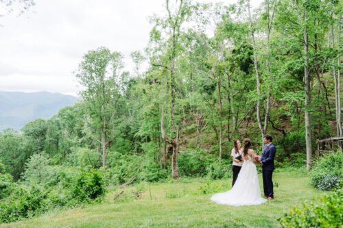 Bride and groom exchanging vows on a private mountaintop elopement near Asheville