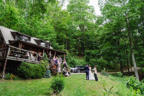 Bride and groom exchanging vows on a private mountaintop elopement near Asheville