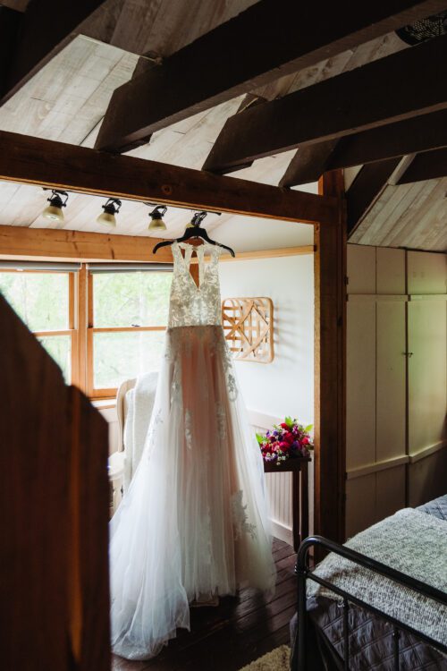 Bride getting ready inside cozy mountain cabin before elopement