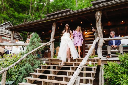 bride walking down steps of cabin in Asheville