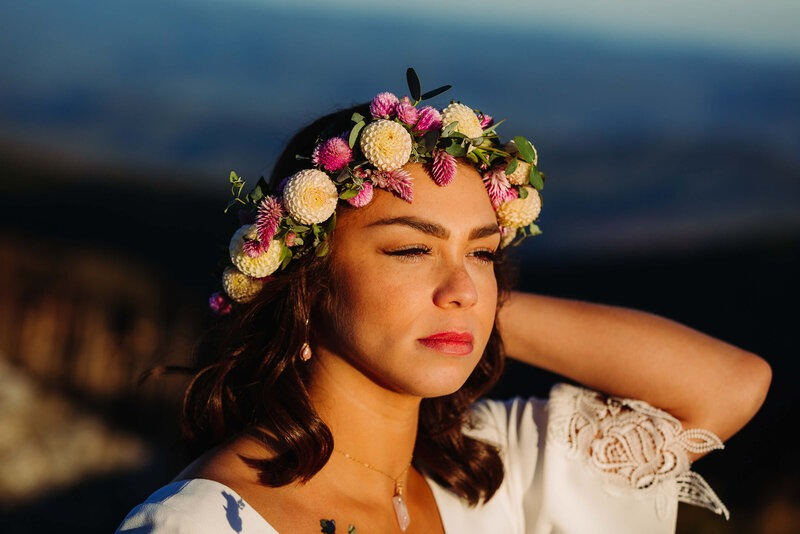 bride looking into the sunset during her sunset ceremony