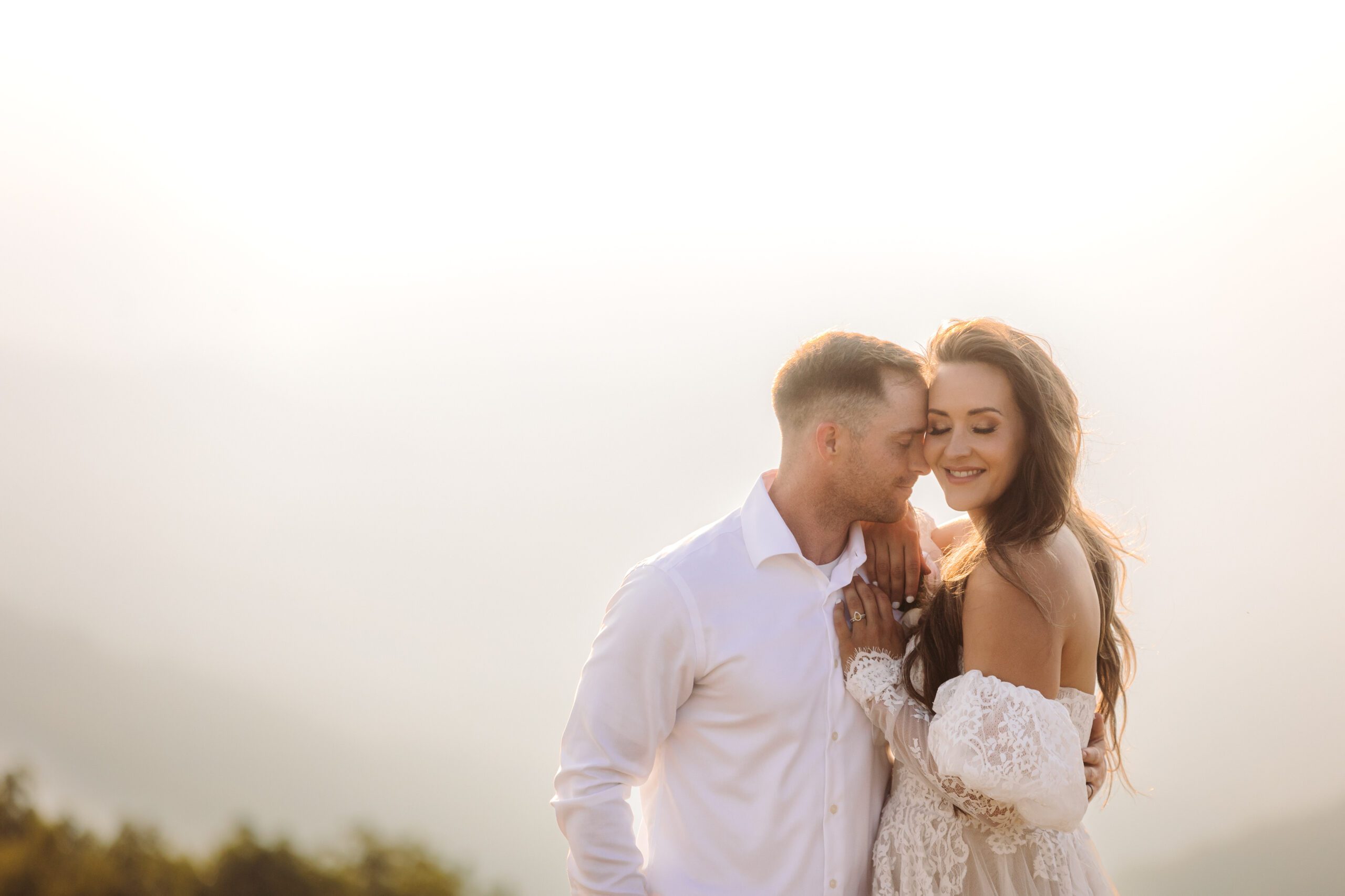 Couple shares a quiet, romantic moment at golden hour in one of the top places to elope in Asheville.