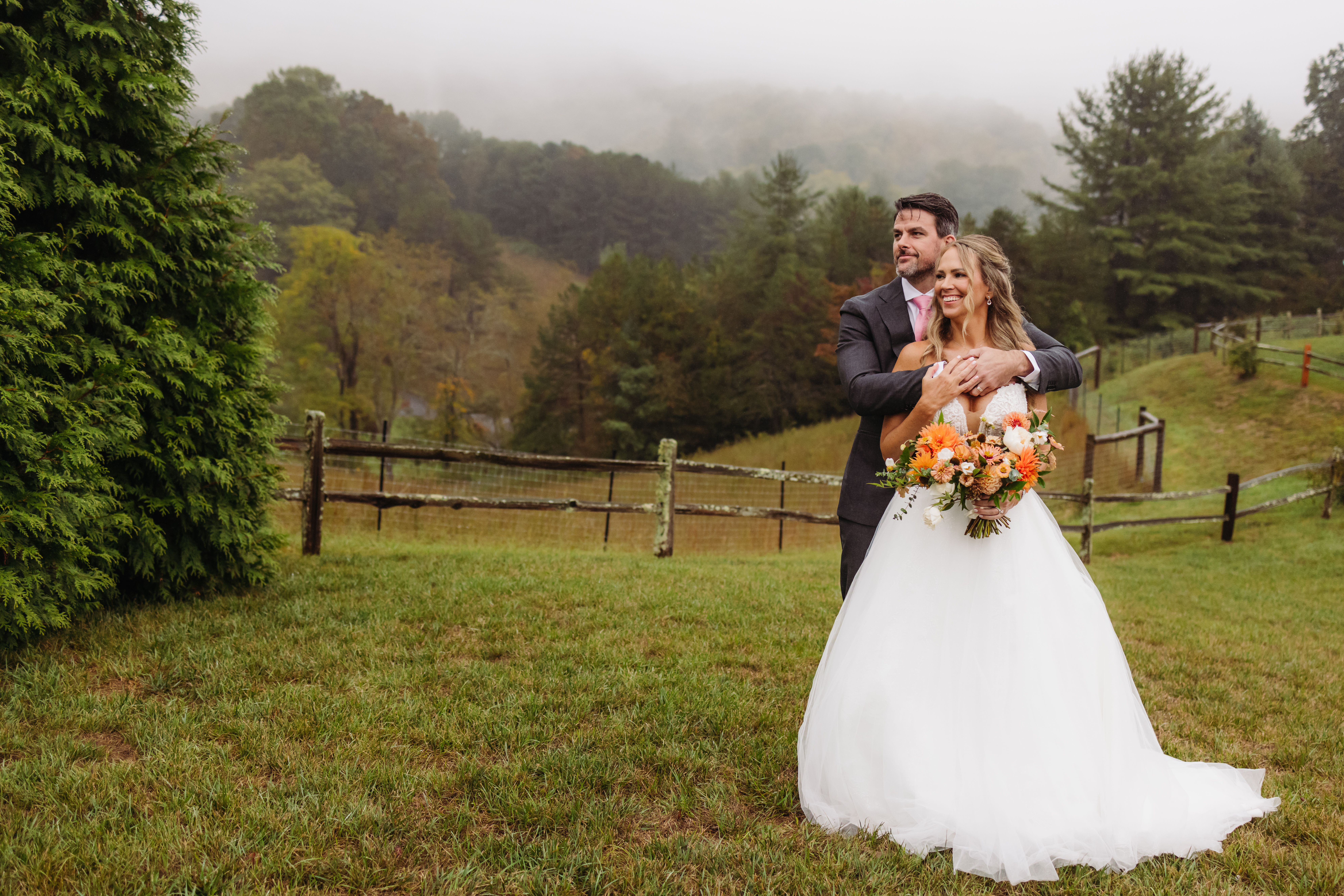 Bride and groom walk hand in hand at sunset, one of the best places to elope in Asheville.