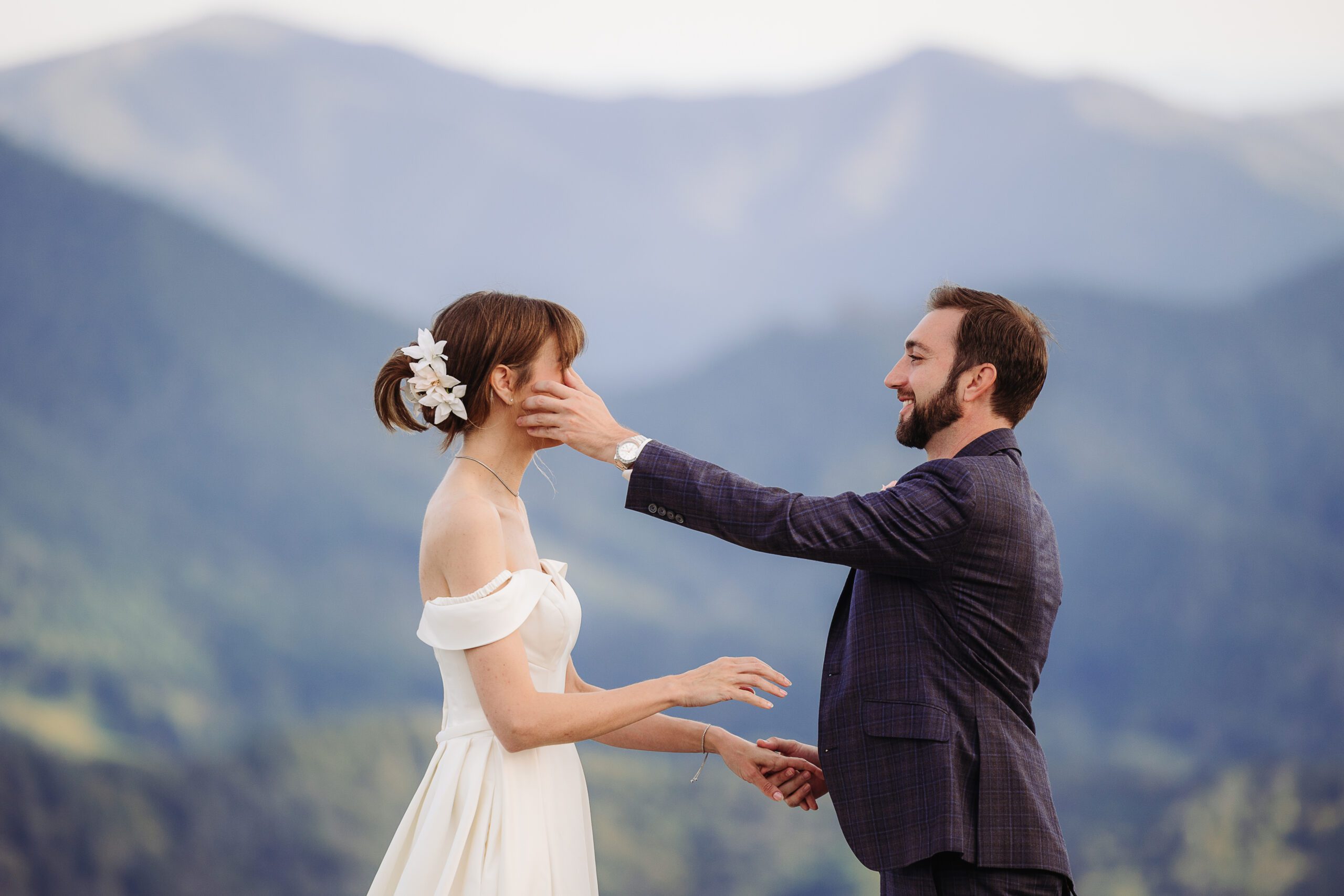 Couple shares a joyful moment in the mountains, beginning their post-elopement adventures in Asheville.
