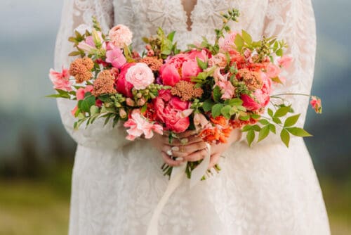 Lush bridal bouquet with seasonal June flowers for an Asheville elopement