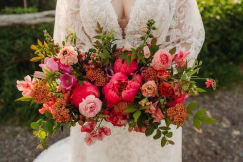 Full, abundant bridal bouquet with seasonal blooms for a Blue Ridge Mountains elopement