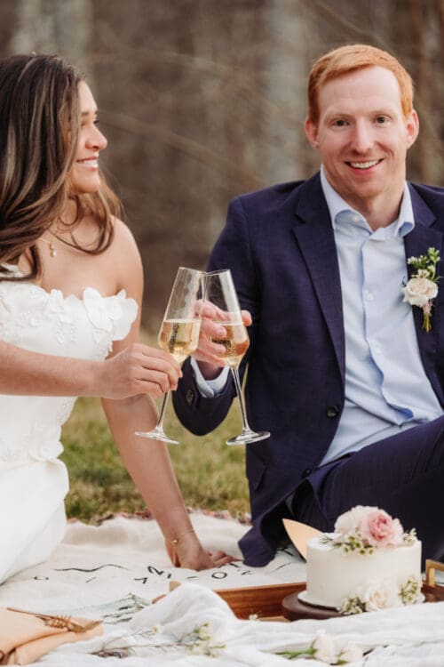 Couple toasting champagne together, relaxed and joyful post-ceremony moment