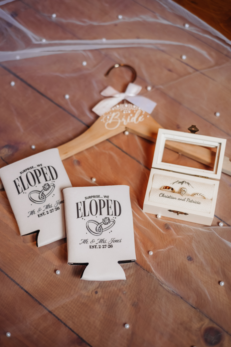 Flat lay elopement details with vow books and hanger, places to elope in Asheville NC