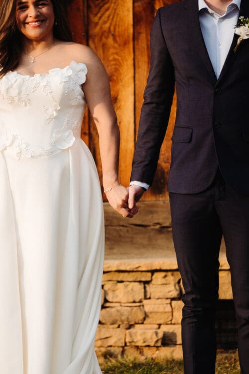 Couple holding hands during ceremony, simple moment at places to elope in Asheville NC