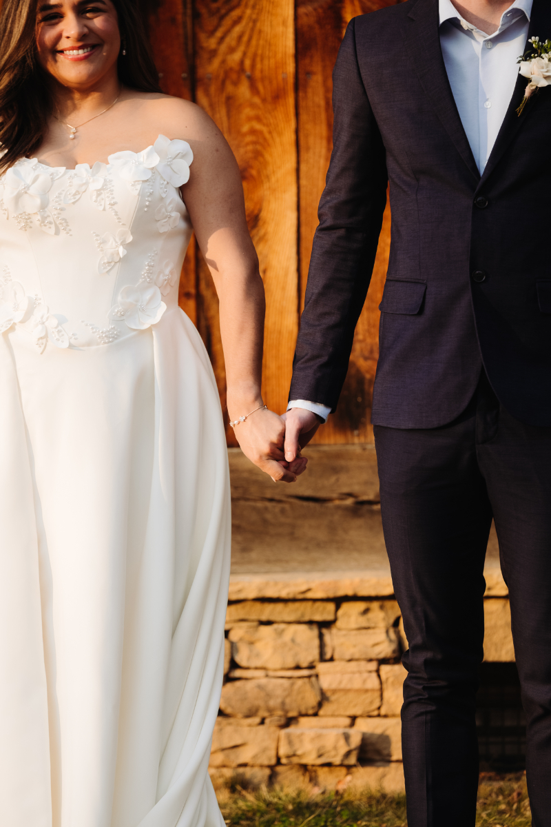 Couple holding hands during ceremony, simple moment at places to elope in Asheville NC