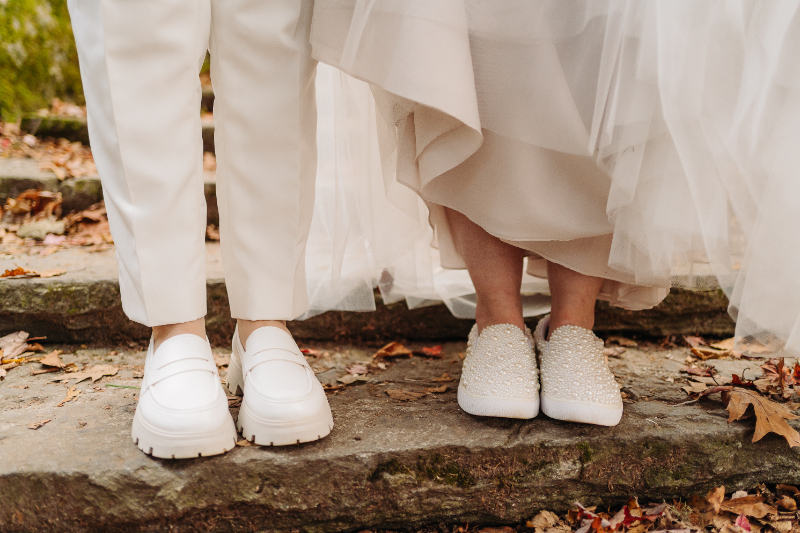 elopement checklist wedding shoes couple standing on stone step intimate mountain ceremony moment