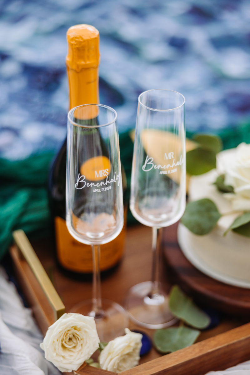 champagne toast with engraved glasses on table elegant celebration detail