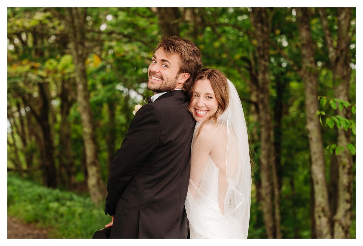Hiking down the mountain after their elopement at Max Patch near Asheville NC
