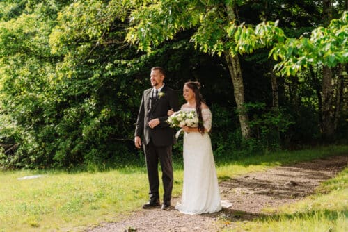 Couple sharing a joyful moment before their anniversary vow renewal in the beautiful Blue Ridge Mountains.
