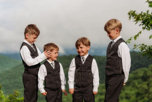 Children laughing together during an anniversary vow renewal overlooking the beautiful Blue Ridge Mountains.