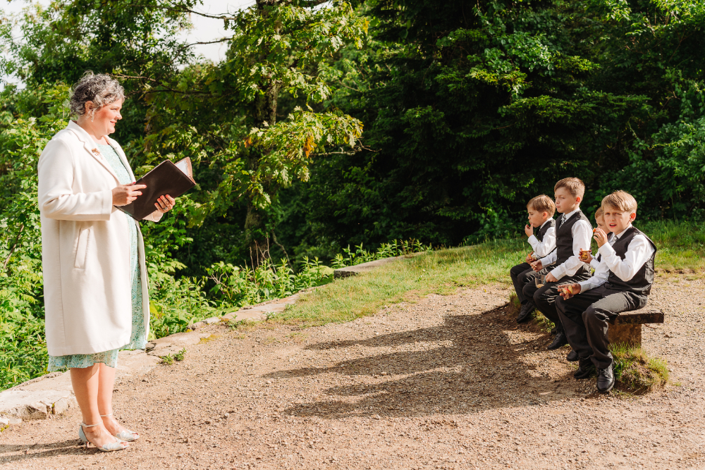 Children watching an outdoor anniversary vow renewal ceremony in the peaceful Blue Ridge Mountains near Asheville.