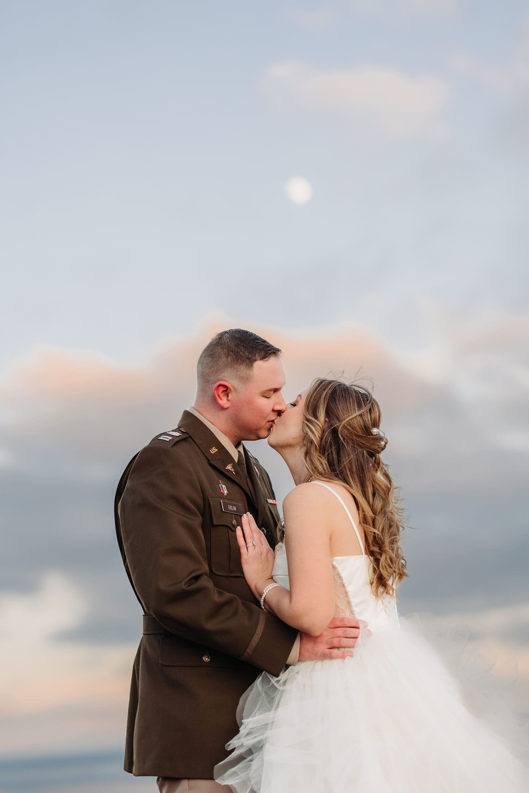 Newlyweds embracing at golden sunset during their Blue Ridge Mountain elopement