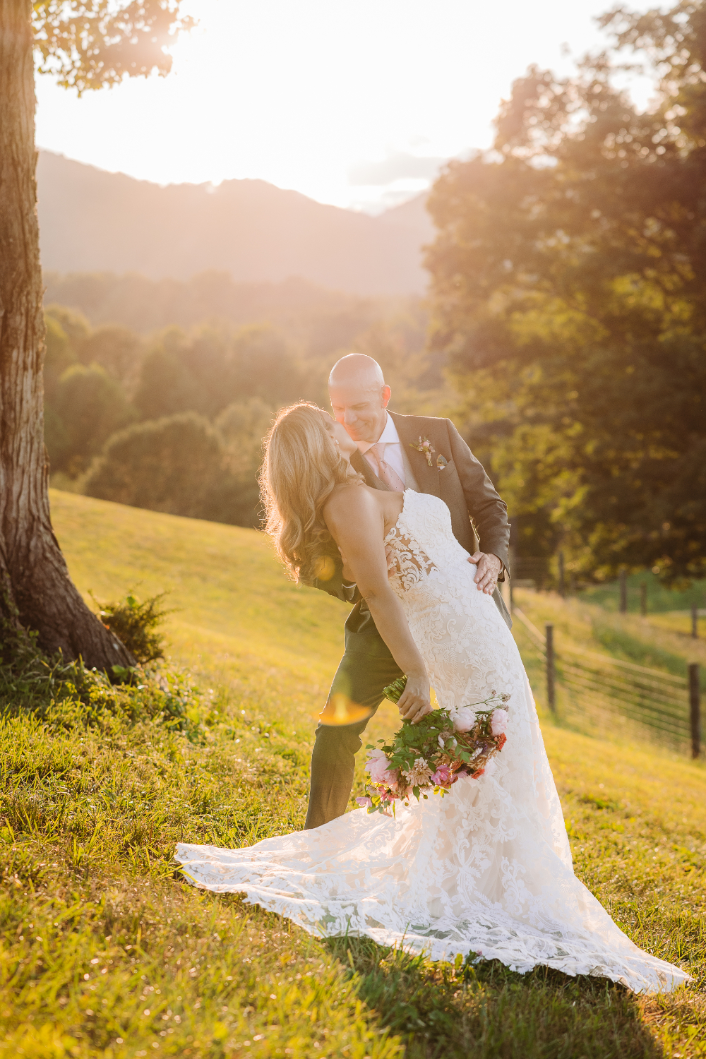 Couple embracing at sunset with Blue Ridge Mountain views, inspiring romantic second wedding ideas outdoors.