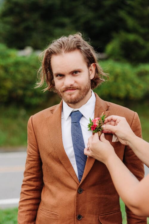 Groom smiling during an Asheville elopement with wedding planning tips for a stress-free wedding day.