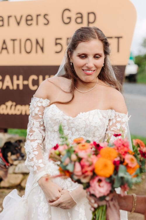 Bride smiling after her ceremony with wedding planning tips for an Asheville mountain elopement.